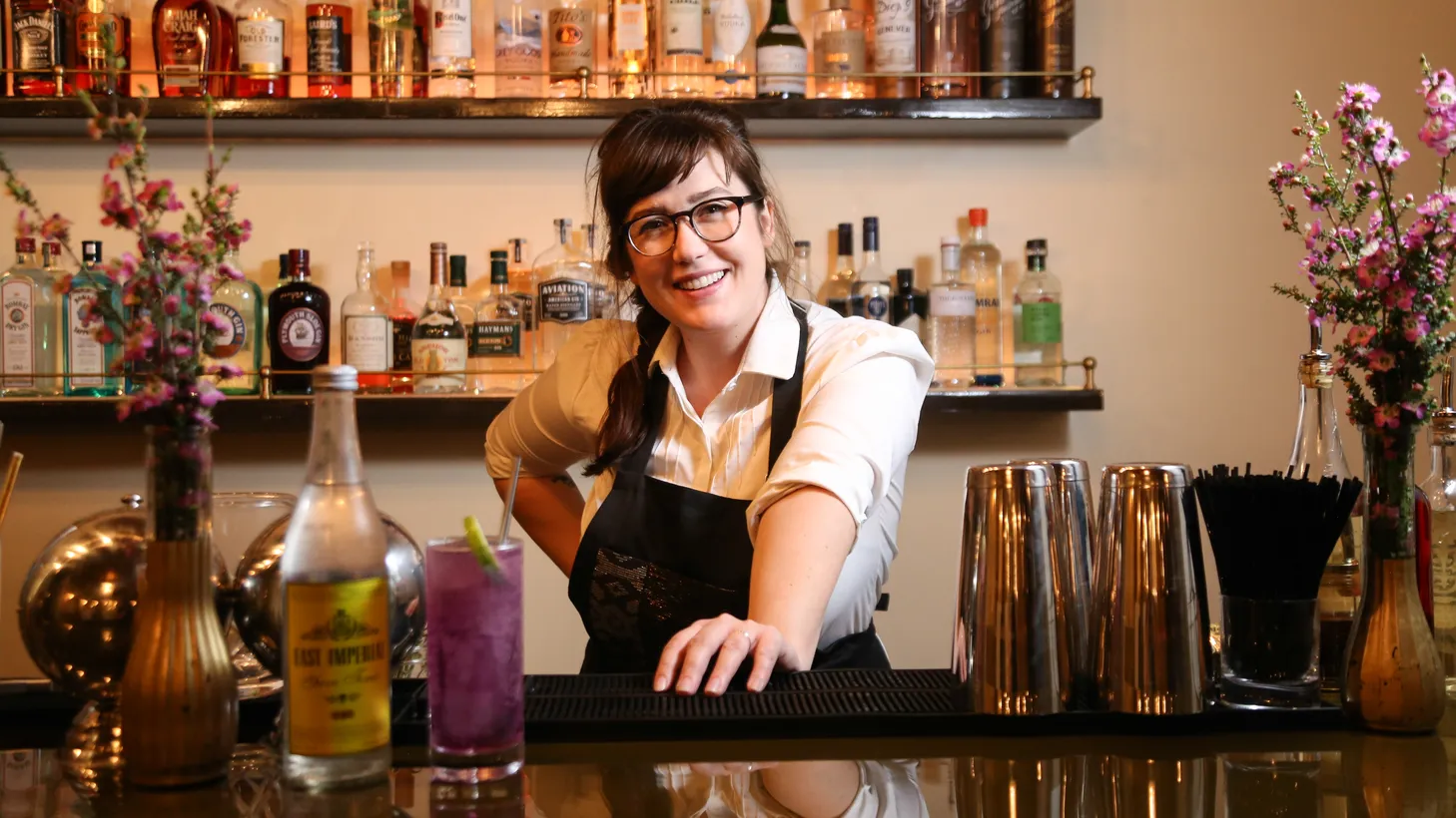 Kelso Norris, Genever’s beverage director, shows off one of her colorful gin creations.