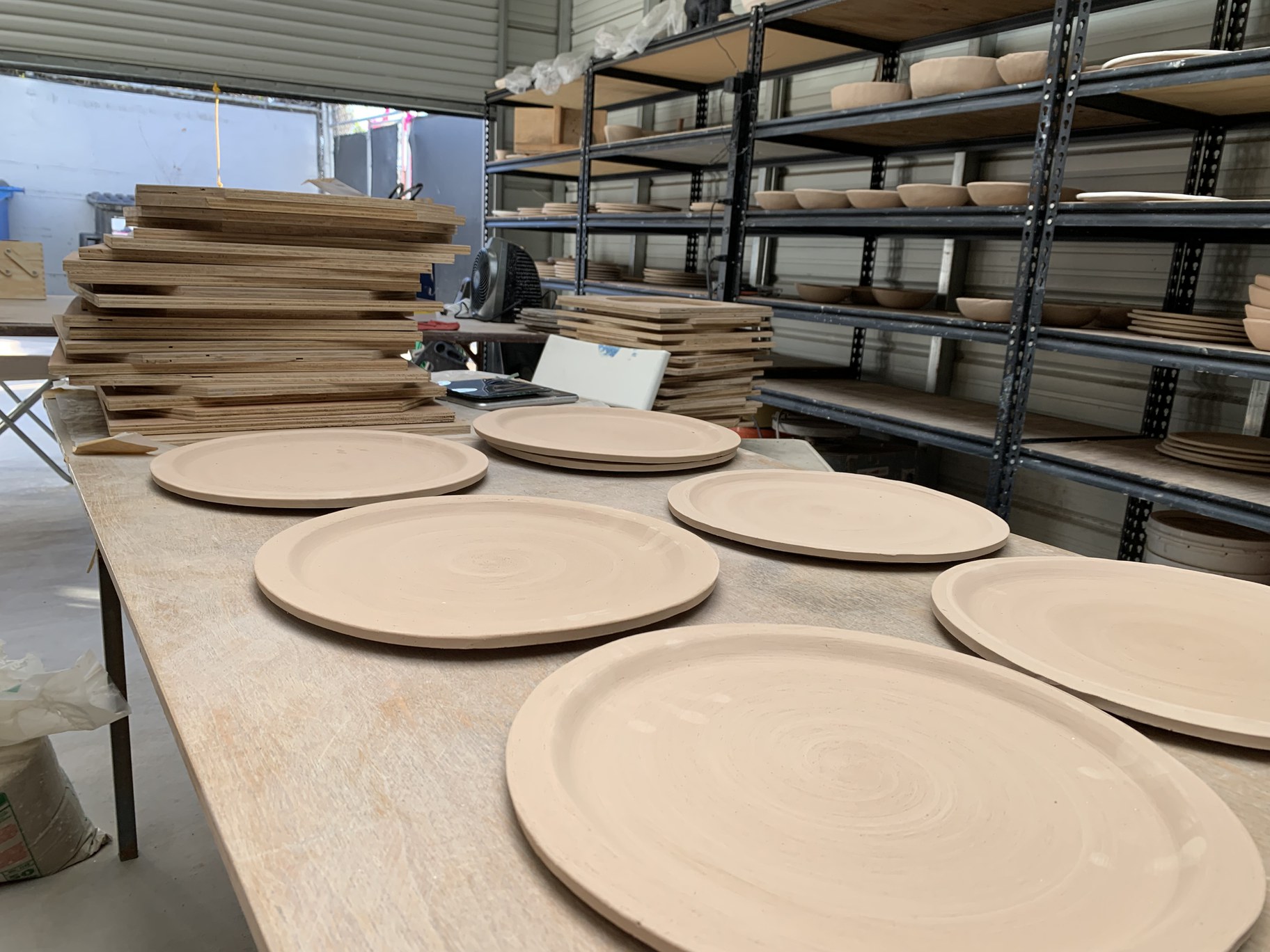 Clay plates sitting out to dry. Photo Credit Andrea Bautista.JPG