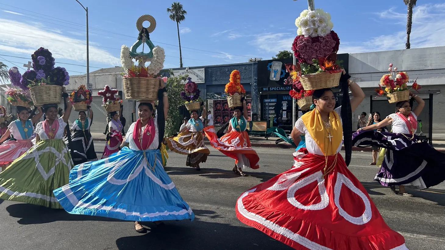 Oaxacan Angelenos parade down Pico Boulevard east of Crenshaw in traditional outfits at the annual Convite Oaxaqueño. Community members are lobbying to rename this stretch of street the Oaxacan Corridor.