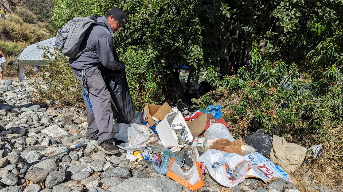 Volunteers with the Canyon City Environmental project have been struggling to manage larger and larger piles of trash along the east fork of the San Gabriel River, as viral TikTok posts have drawn large crowds.