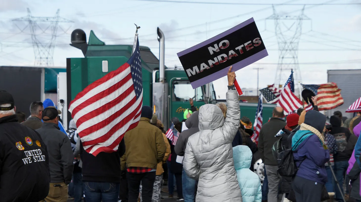 Truckers and their supporters form a convoy bound for the nation's capital to protest coronavirus disease (COVID-19) vaccine mandates, in Adelanto, California, U.S. February 23, 2022.