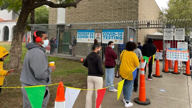 Students wait in line at a COVID testing site run by LAUSD in Leimert Park.
