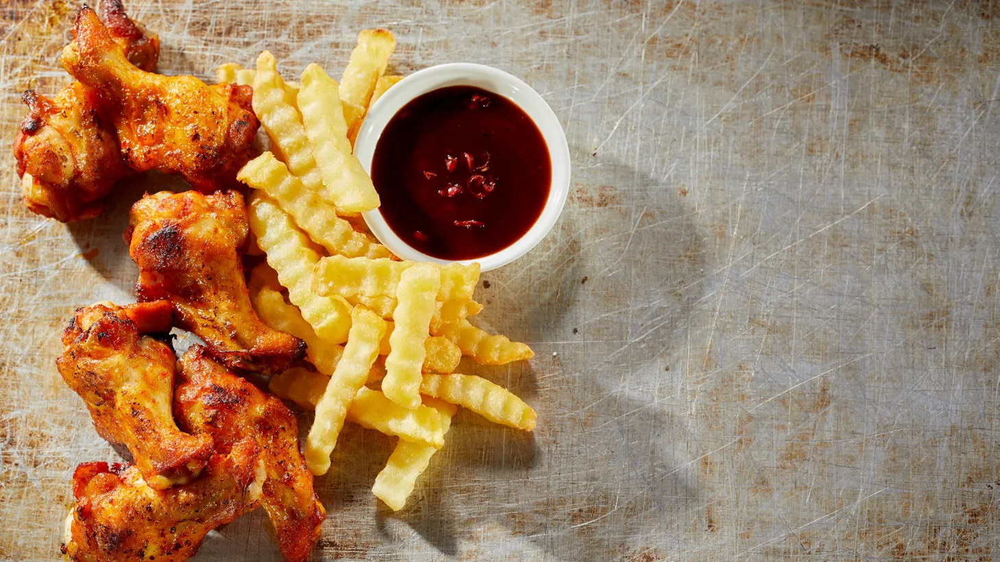 You can get spicy fried chicken with crinkle-cut fries at Dodger Stadium.