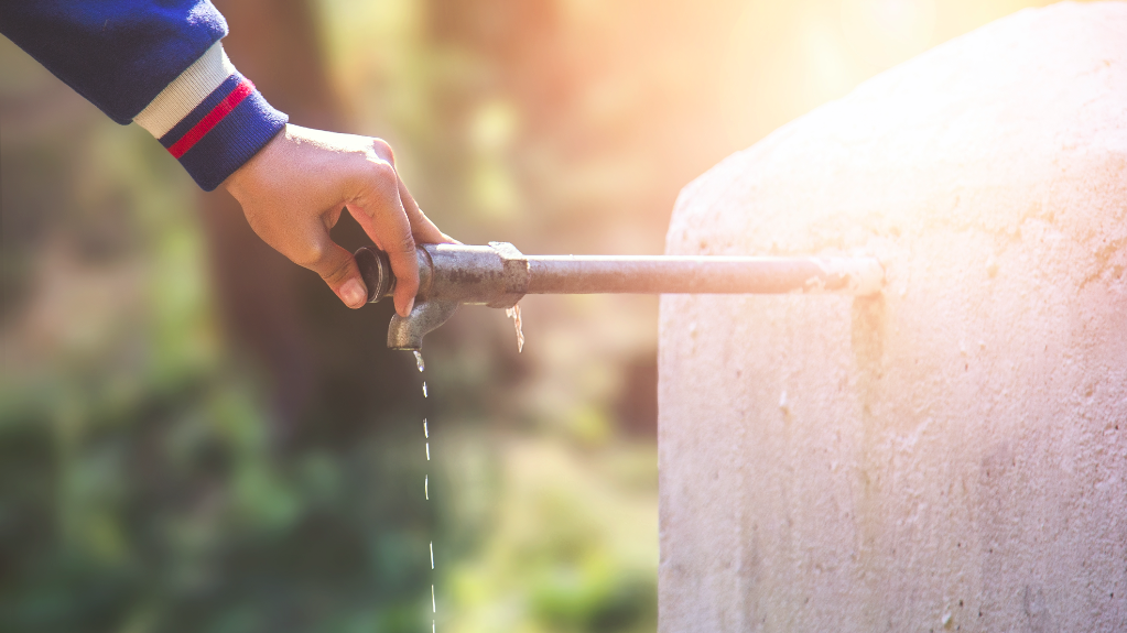 A person closes a water faucet. LADWP wants 70% of its users’ water to come from local sources by the year 2035.
