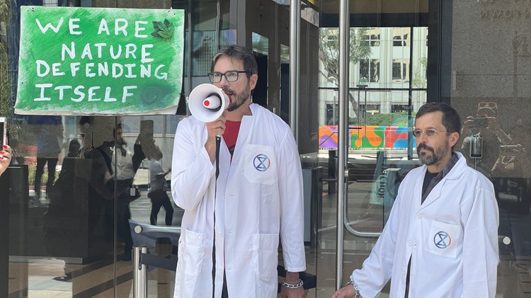 As part of a worldwide campaign calling for stronger action against climate change, four scientists recently chained themselves to a downtown LA building.