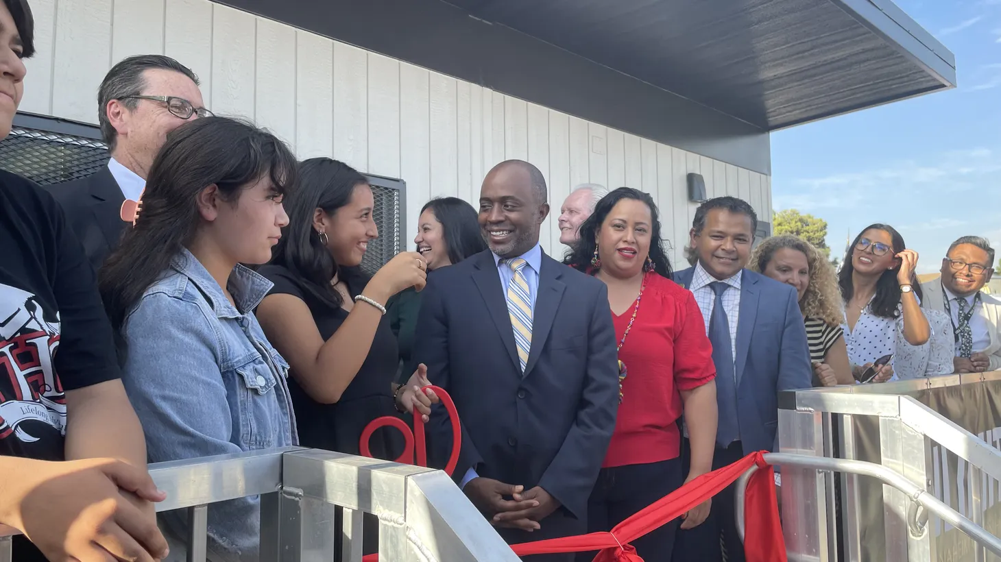 State Superintendent of Schools Tony Thurmond (center) attends a ribbon-cutting ceremony at Sycamore Junior High School’s reopening as a community school in September.