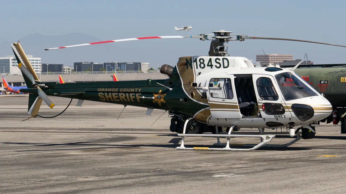 An OC Sheriff's Department helicopter is parked at SNA Airport, April 9, 2022.