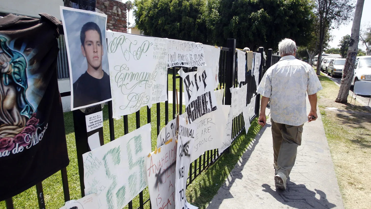 Posters, photos, and signs in support of Manuel Diaz — who was shot dead on July 21, 2022 by Anaheim police — are seen at the site of the shooting on Anna Drive in Anaheim, California, August 4, 2012.