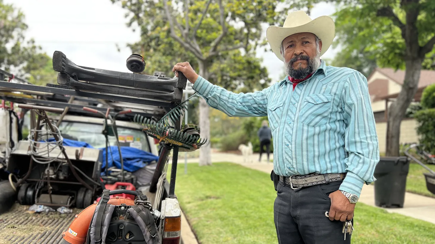 Gardener Tomás Saucedo poses with his truck and gas-powered leafblower in South Pasadena.