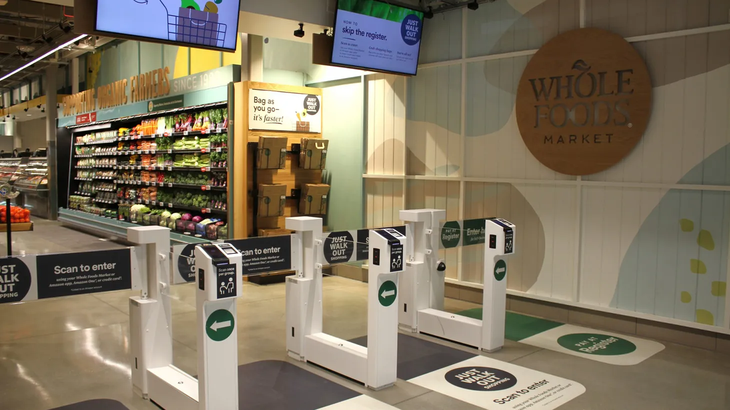 At the entrance of Whole Foods in Sherman Oaks, customers scan a QR code or their palm to begin shopping.