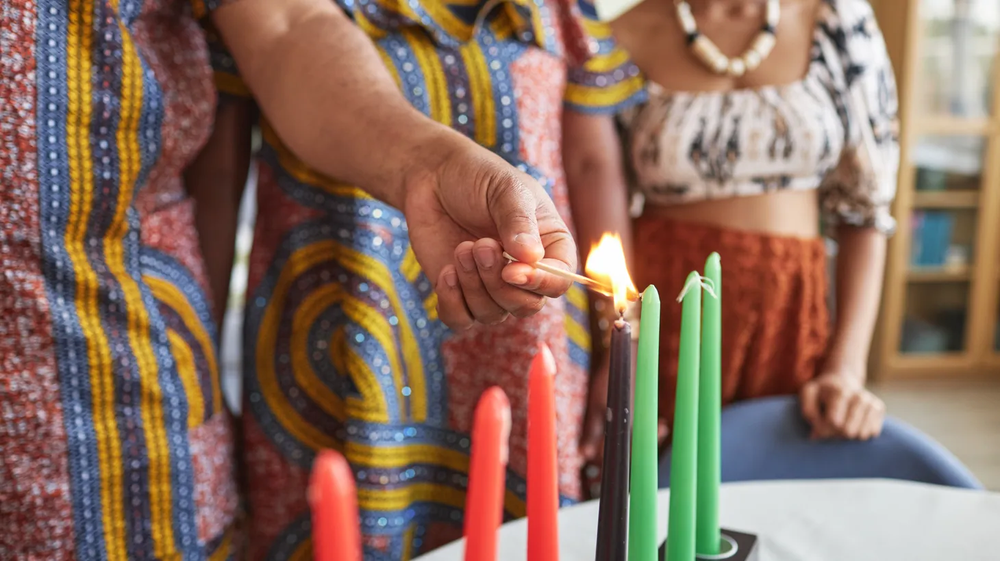 A family burns seven candles for Kwanzaa.