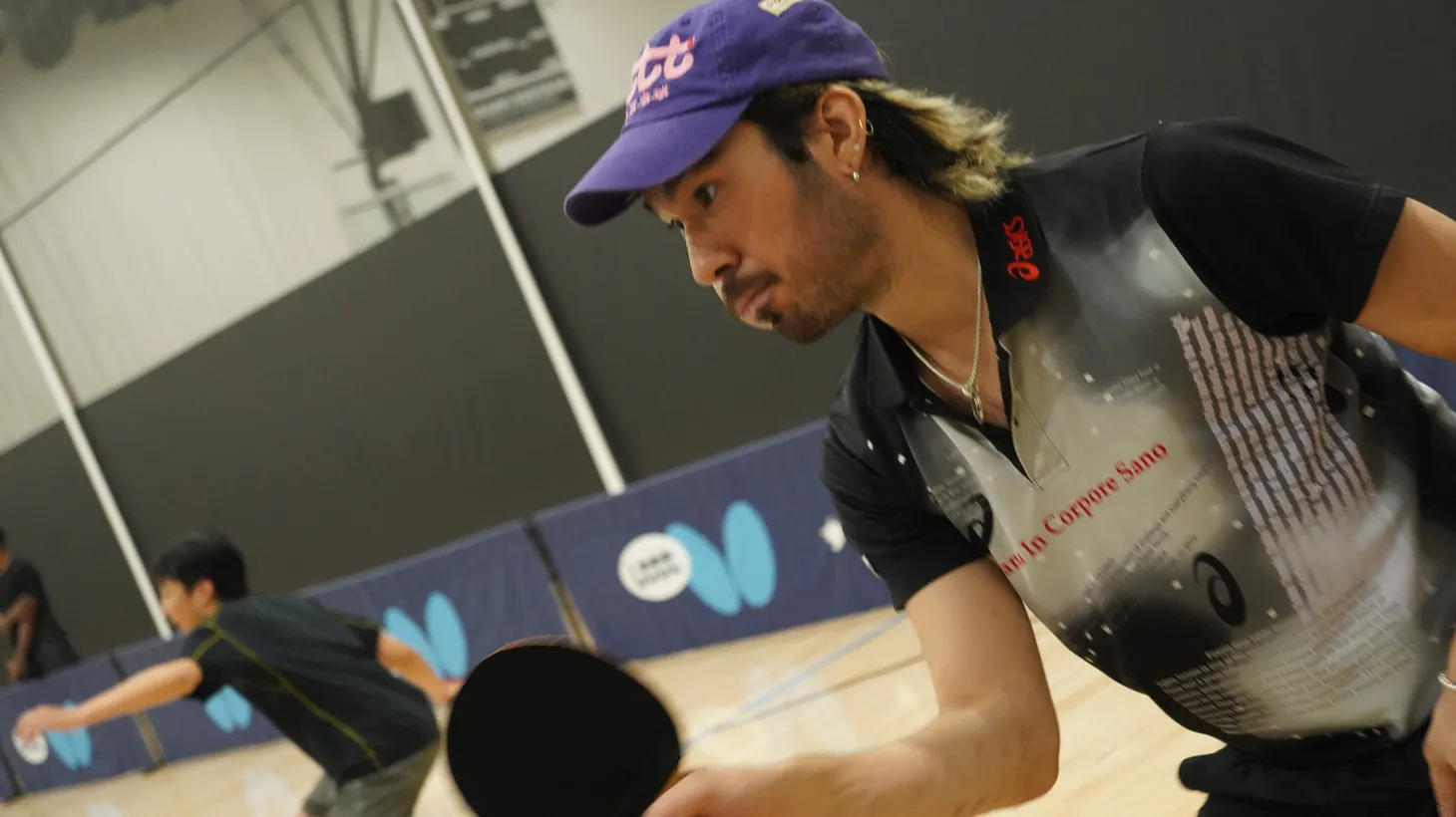 Jiro Maestu wields a ping pong paddle at Little Tokyo Table Tennis Club, which he founded in 2021.
