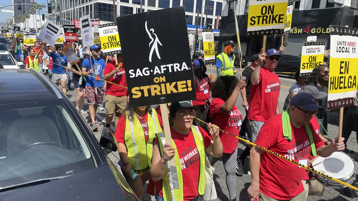 Striking Hollywood actors and writers joined picketing hotel workers during a march down Sunset Boulevard on July 21, 2023.