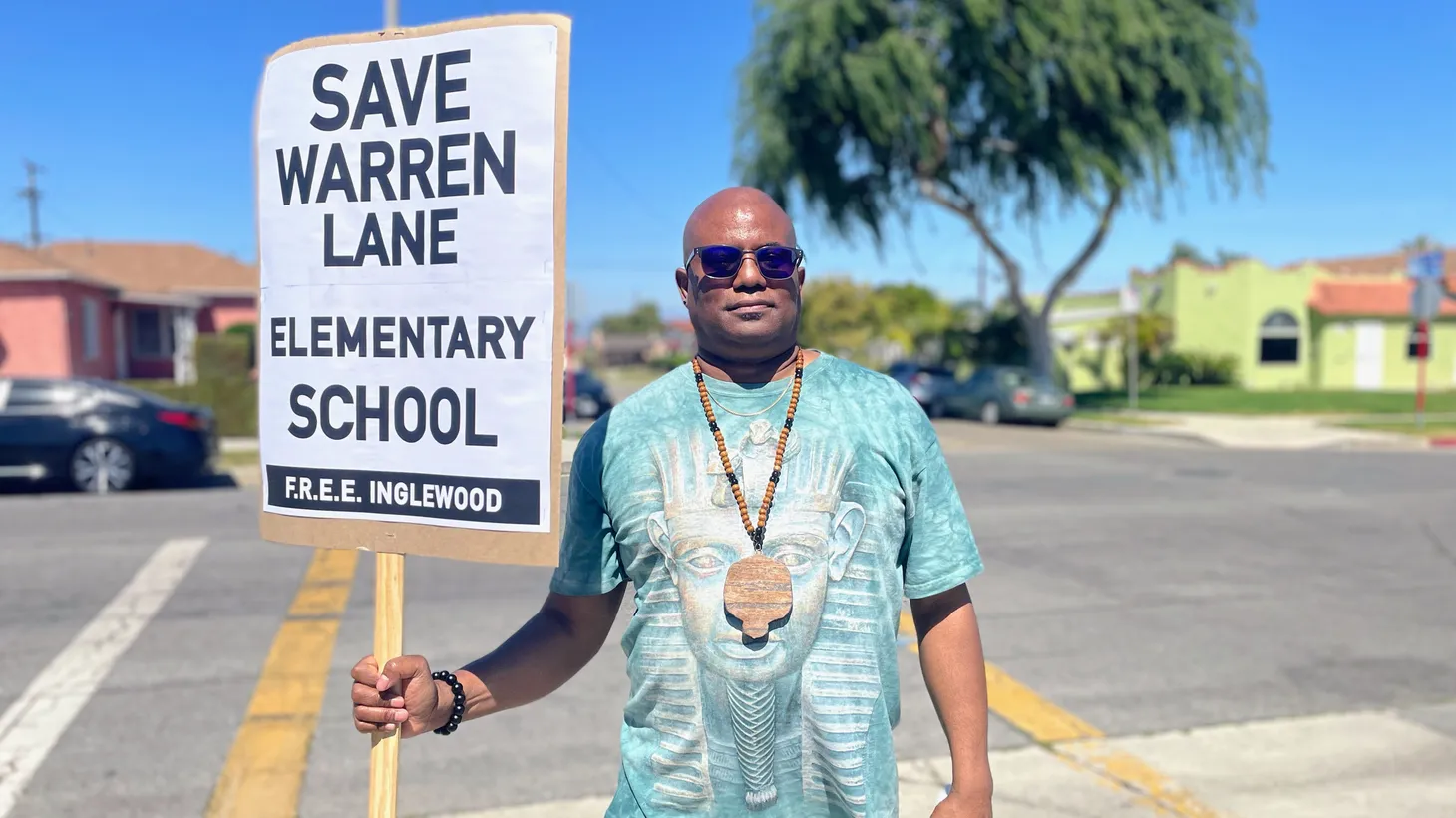 John Hughes peacefully protested the planned closure of Warren Lane Elementary School on March 24, 2022.