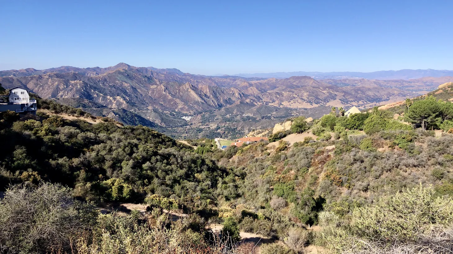 Malibu hills are seen from Piuma Road. The city is a mix of upscale and rural homes. The Malibu City Council is pursuing a plan to reserve shelter beds outside city limits and offer unhoused people transportation to that location.
