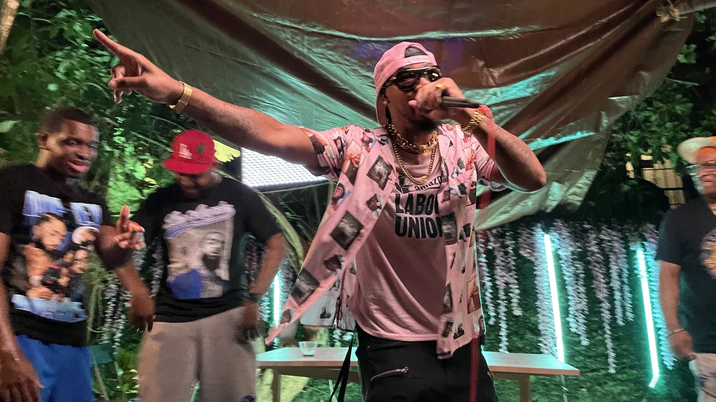 Chris Smalls raps a call-and-response to a young Los Angeles crowd: “Billionaires they gotta go. F**k Jeff Bezos.”