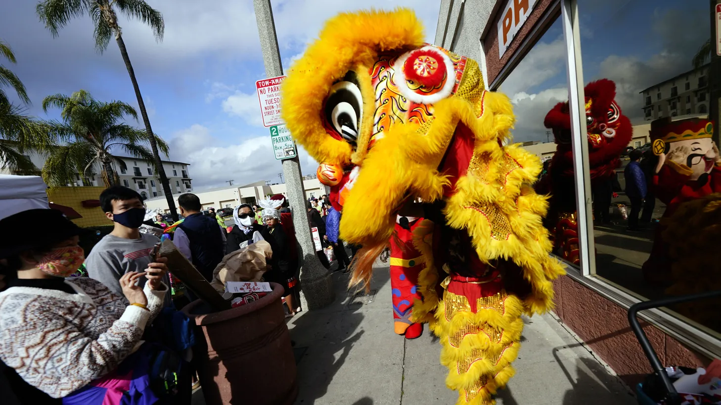 A lion dance troupe prepares to perform at the Alhambra Lunar New Year celebration, Jan. 29, 2023.