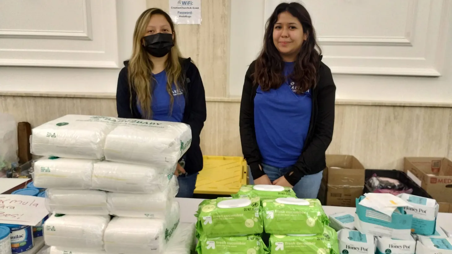 Volunteers welcome asylum seekers with hygiene articles, food, and medical resources.