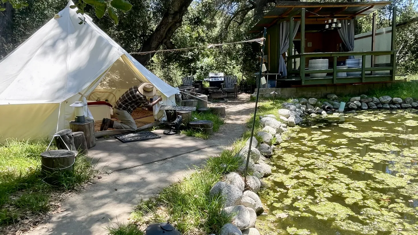 JB Wagoner prepares the glamping site called Temecula Bullfrog Pond, which he rents to travelers on his 20-acre ranch outside of Temecula. Private property owners like him are tapping into the growing upscale camping market.