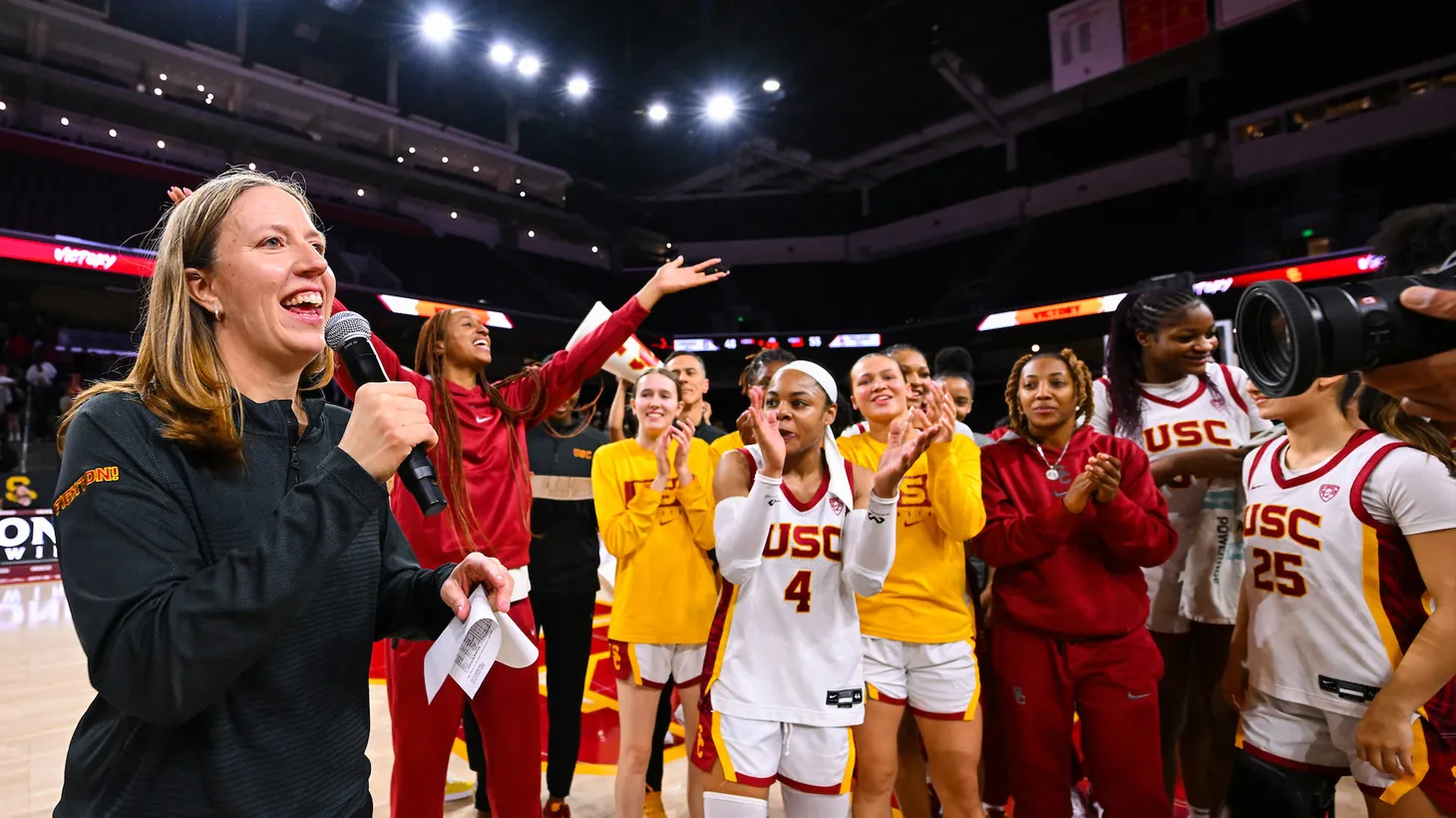 Lindsay Gottlieb, USC women’s basketball team head coach celebrates with team.