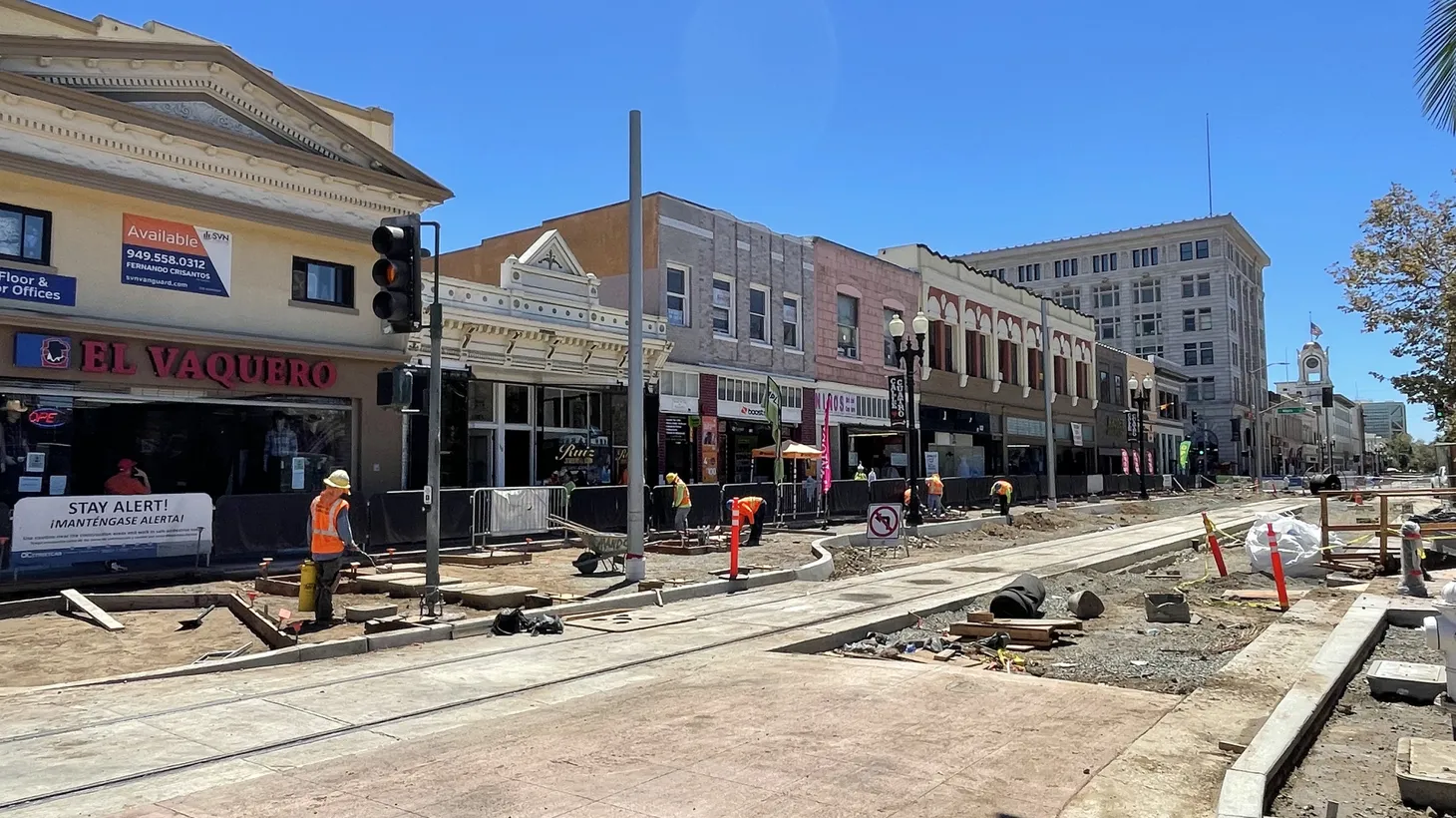 The construction zone on Fourth Street in downtown Santa Ana is closed to cars. Shoppers must navigate on foot to visit stores.
