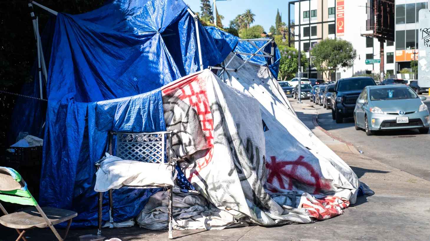 A large homeless camp sits on the sidewalk in Hollywood. Angelenos living on the streets are able to share their stories via Theo Henderson’s podcast “We The Unhoused.”