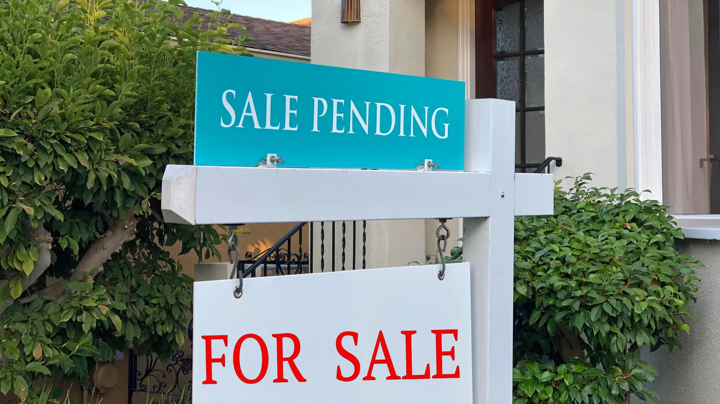 A sign in front of a California home says “sale pending.” Realtor Dunia Handy Gill says in Pasadena, some homes are purchased within a month of being listed.