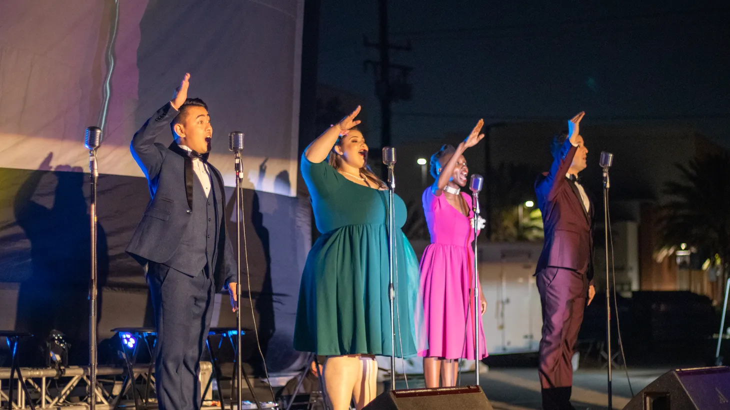 Aaron Jacobs (far right) performs with his 13-piece band, The Swing Tones, at Summer Swing Nights. Though normally the event takes place in the Zimmerman Automobile Driving Museum, Jacobs and The Swing Tones performed a drive-in show at El Camino College in June 2021, at the peak of the pandemic.