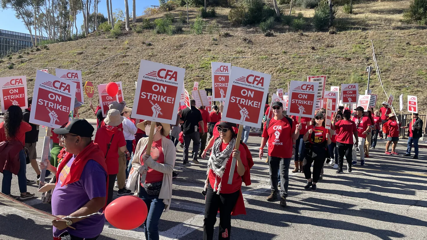 About 300 picketers marched in a one-day strike at Cal State LA to demand higher wages for faculty.