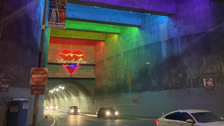 Tory DiPietro’s new neon art installation is lighting up the 3rd Street tunnel in downtown LA with rainbow colors and her love for Los Angeles.