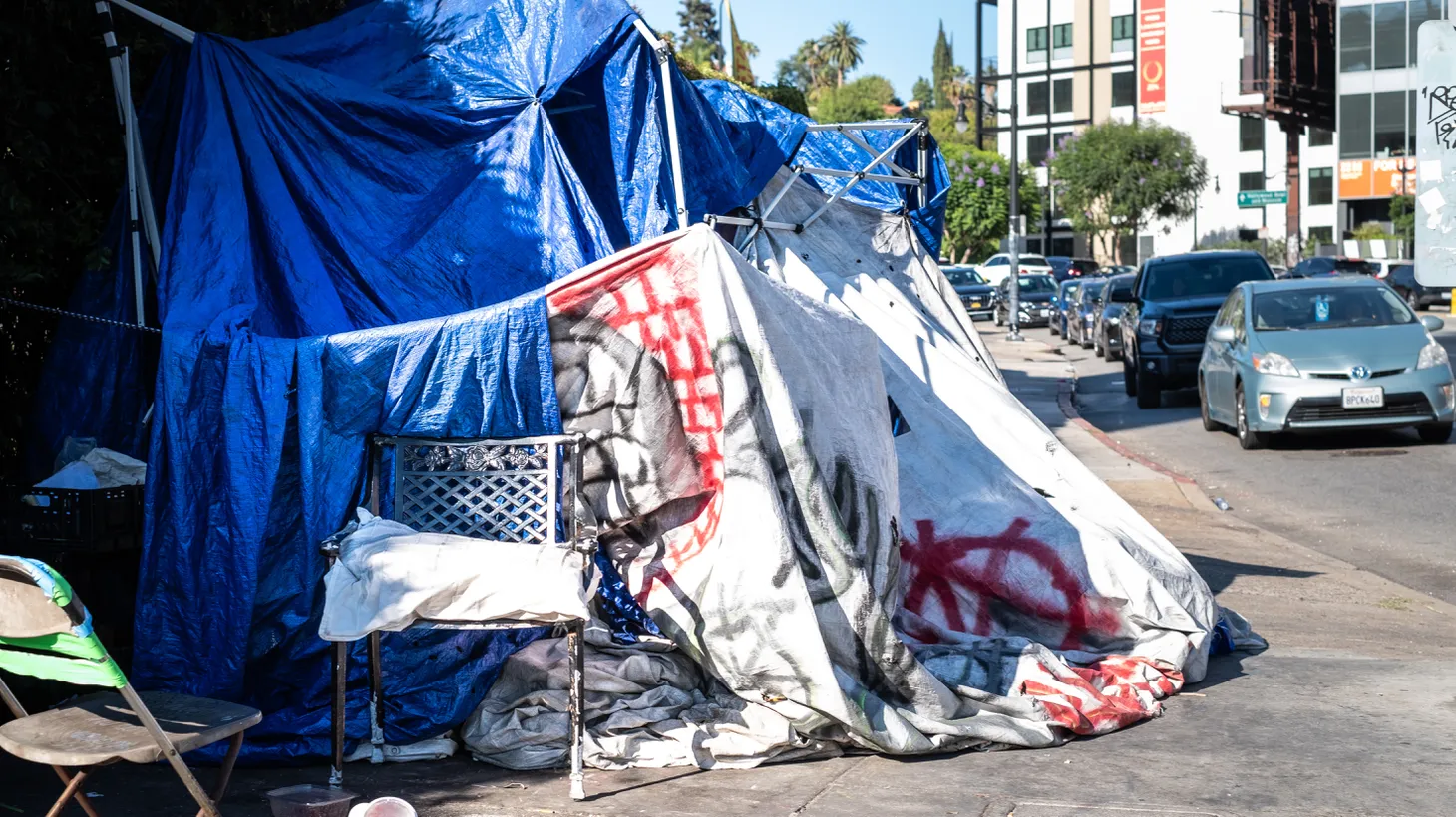A large homeless encampment is erected in Hollywood, California. Some activists say unhoused people are unfairly targeted by LA Municipal Code ordinance 41.18, which bans people from sitting, laying, or sleeping in large swaths of the city.