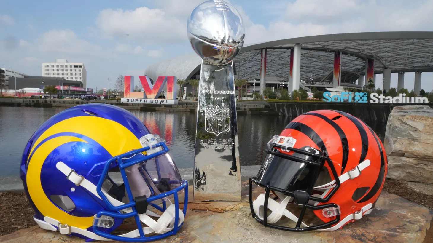 Los Angeles Rams and Cincinnati Bengals helmets are seen with a Vince Lombardi trophy at SoFi Stadium. The Rams and Bengals will play in Super Bowl LVI on Feb. 13, 2022.