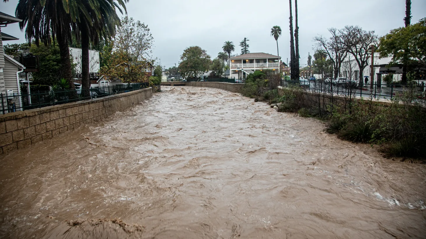 Water flows in the rain-swollen Mission Creek after a storm in west Santa Barbara, California, U.S. January 9, 2023.