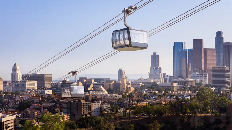 Conflict over a proposed aerial gondola to carry fans to and from Dodger Stadium is heating up. Is it a traffic solution or a dubious development plan?