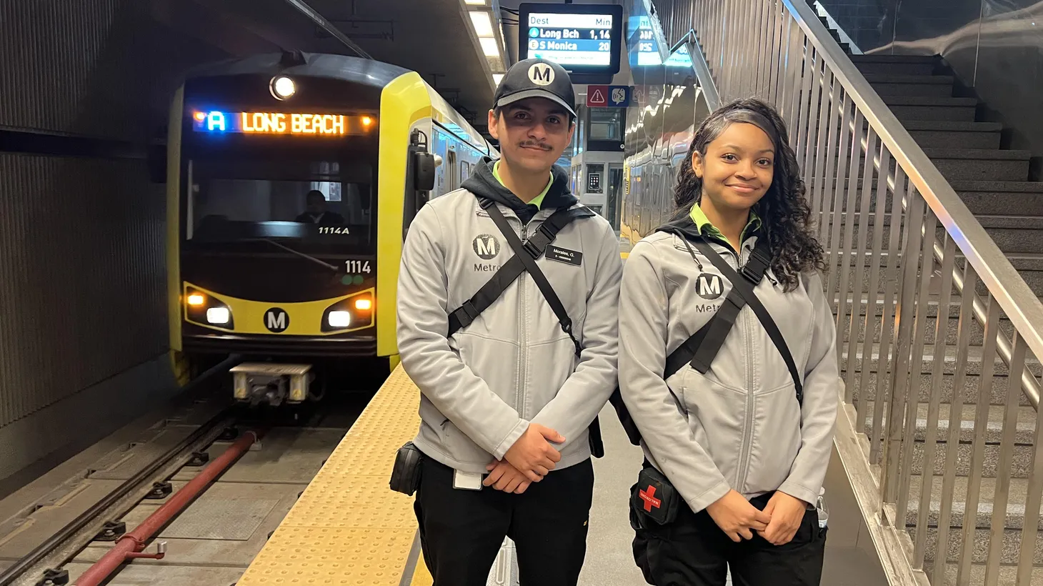 Metro Ambassadors Gilberto Morales and Aryna Moore are photographed at the Bunker Hill light rail station.