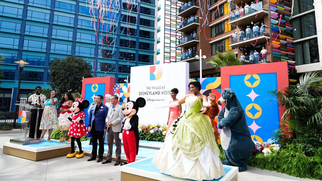 Disney characters and cast members wave at the grand opening of The Villas at Disneyland Hotel, in Anaheim, California. Sep. 28, 2023.