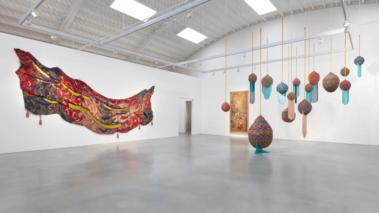 At Suchitra Mattai’s exhibition “In the absence of power, In the presence of love,” she shows all kinds of inventive weaving, creating soft sculptures, tapestries, and even long scrolls made from saris.