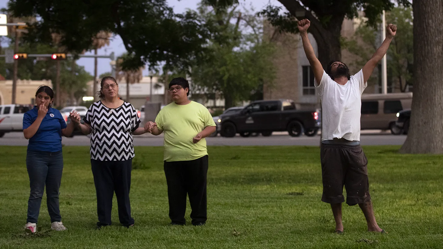 Community members gather in prayer at the Uvalde downtown plaza following the shooting at Robb Elementary School in Uvalde, Texas on May 24, 2022.