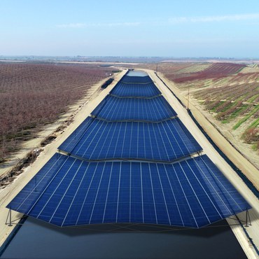California needs to save more water and create more renewable energy. A new solar panel project on exposed water canals will bring a lot of both.