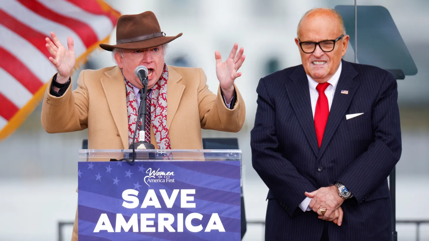 Chapman University law professor John Eastman, next to U.S. President Donald Trump's personal lawyer Rudy Giuliani, gestures as he speaks while Trump supporters gather ahead of his speech to contest the results of the 2020 U.S. presidential election in Washington, U.S, January 6, 2021.