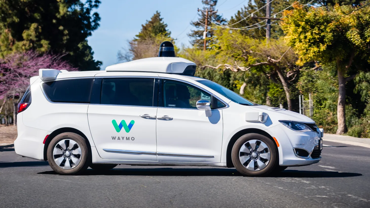 A Waymo self-driving car performs tests on a street near Google's offices in Silicon Valley.