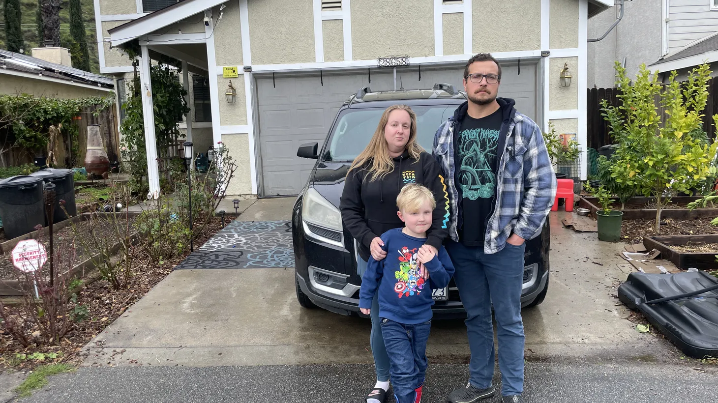 Jennifer Elkins says her youngest son (center) and his two siblings get bloody noses regularly, and they run to the car covering their mouths (because the air smells so putrid) when she picks them up from school.