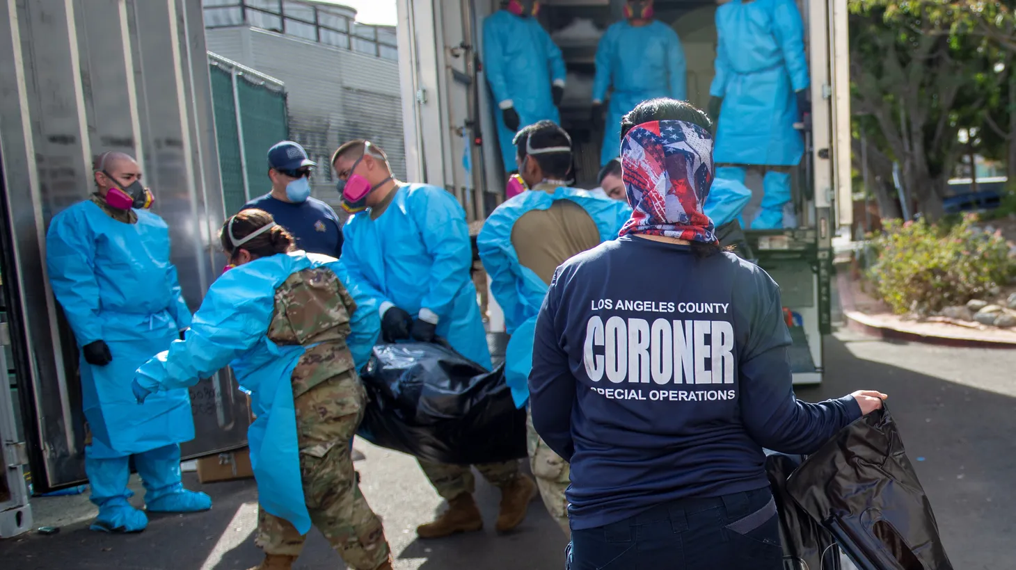 California National Guard personnel assist in the processing of coronavirus disease (COVID-19) deaths and place them into temporary storage in an LA County Medical Examiner-Coroner Office facility in Los Angeles, California, U.S., January 12, 2021.