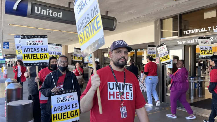 The cashiers, cooks, baristas, and bartenders represented by Unite Here Local 11 are pushing airport concessionaire Areas USA for better benefits and wages.