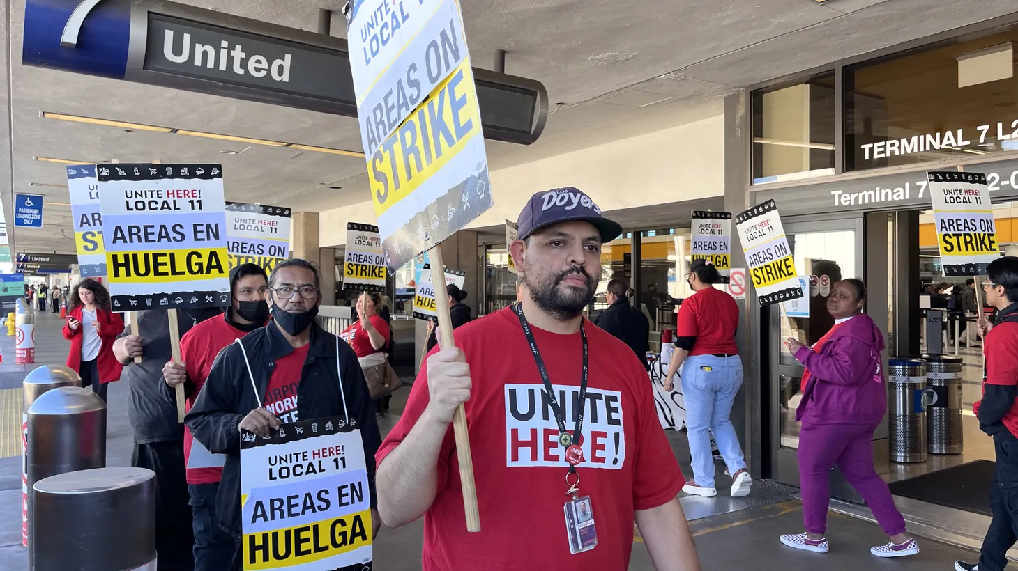 Striking food and concession workers picket outside of LAX’s United Airlines terminal on Nov. 21, 2023.