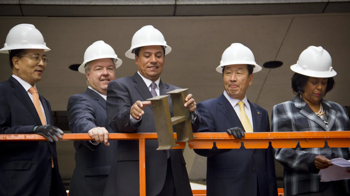 Then-LA City Councilman Jose Huizar (center) attended the Wilshire Grand Hotel demolition event in 2012 and removed the hotel's iconic lettering above the Wilshire Boulevard entrance.