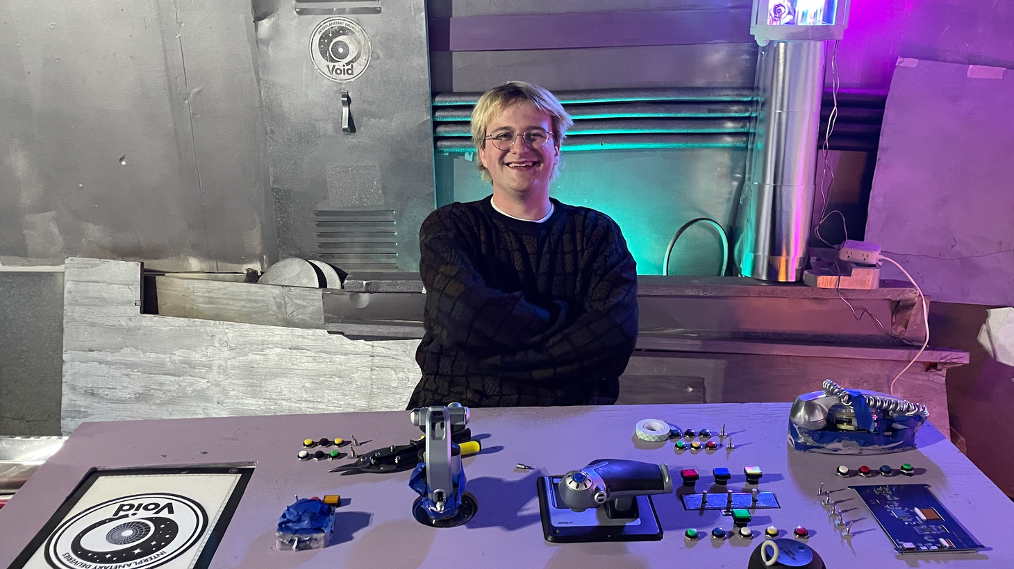 Elliott Walker, 22, sits at the controls of his homemade spaceship, the centerpiece of his latest TikTok series.