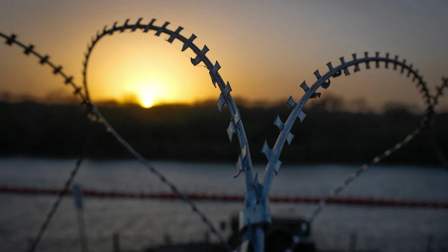 A buoy barrier in the Rio Grande and razor wire along the U.S. border in Eagle Pass on January 8, 2024.