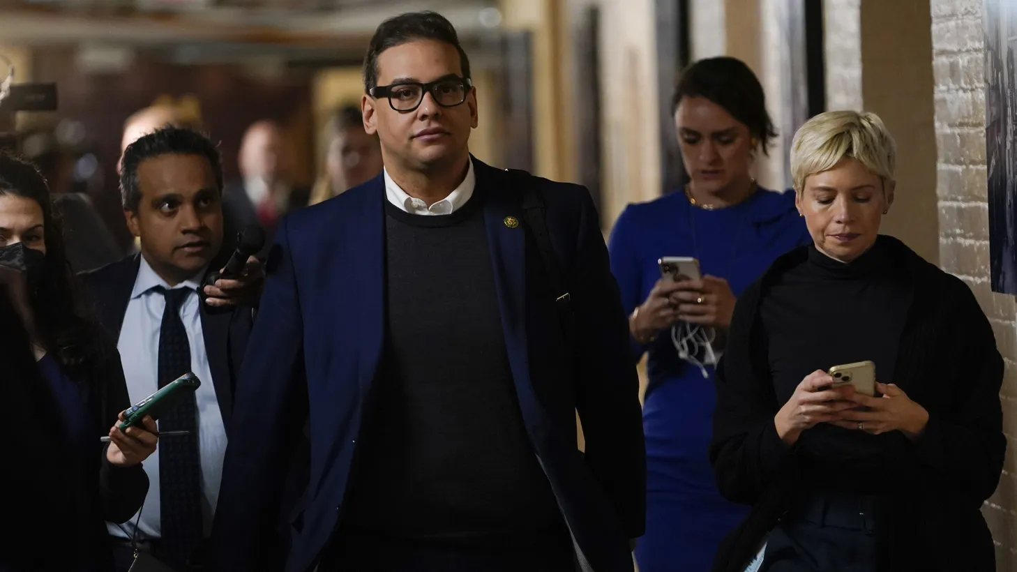 Rep. George Santos departs a morning GOP Conference meeting on Tuesday, January 31, 2023 at the U.S. Capitol after telling his House Republican colleagues he would recuse himself from his committee positions.