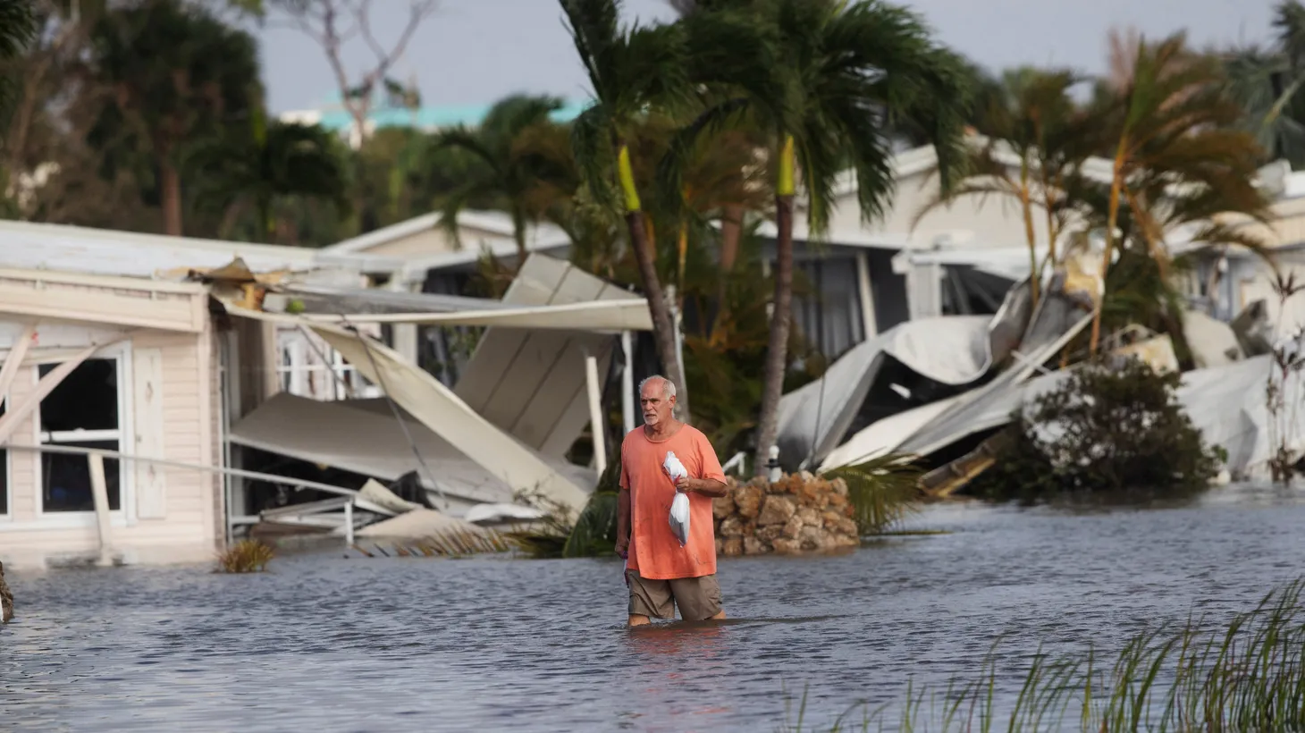 Stan Pentz walks out of a Iona neighborhood after Hurricane Ian hit Florida, U.S., September 29, 2022.